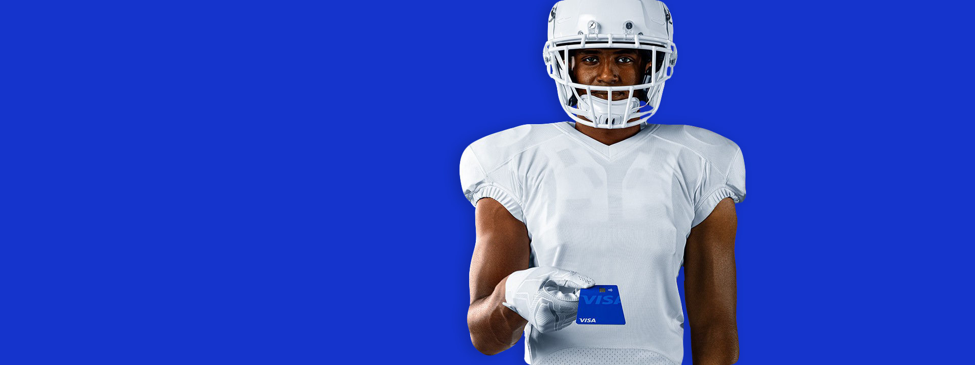 football player holding visa card