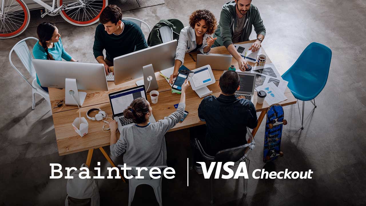 Braintree and Visa Checkout logos superimposed on a group of people sitting around a large office work table.