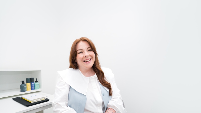 Smiling woman sat down