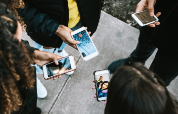 People on their phones in circle