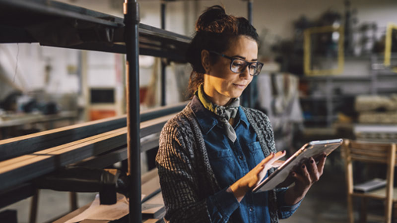 Woman checking a tablet computer